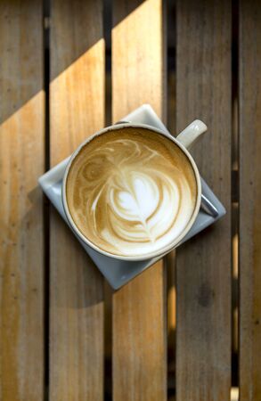 Coffee latte with on wooden tableの写真素材