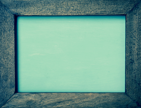 Vintage green tone wooden frame on green backgroundの写真素材