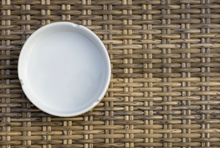 White ashtray on wood backgroundの写真素材