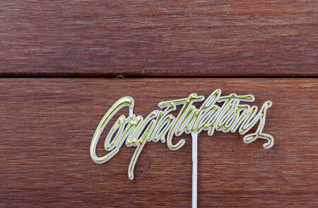 Congratulations on wood backgroundの写真素材