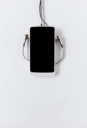 Smartphone on white background, vertical styleの写真素材