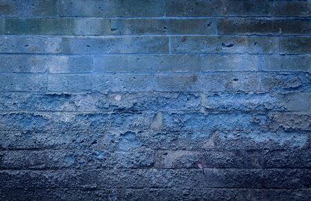 Vintage blue tone old brick wall backgroundの写真素材