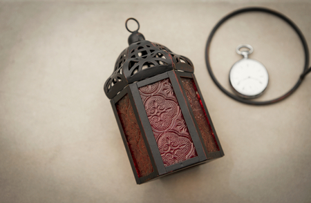 The metal lantern with vintage watch