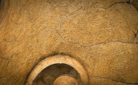 Yellow old cemnet wall design in summer suny day background