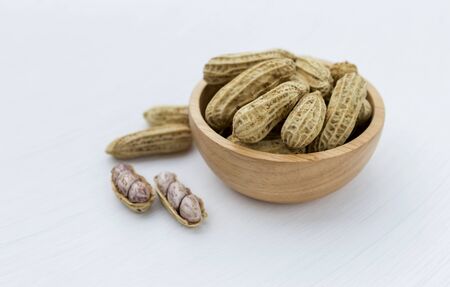 Steamed peanut in wooden bowl