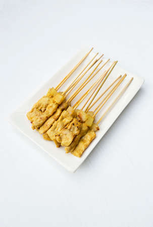 Grill pork satay on white texture backgroundの写真素材