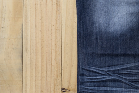 Blue jeans on wood backgroundの写真素材