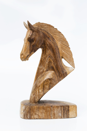 Wooden horse head statute on white backgroundの写真素材