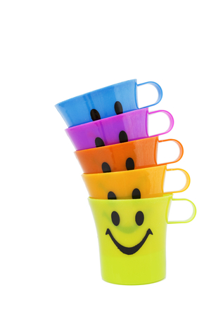 Party colorful plastic cup with smile on white backgroundの写真素材