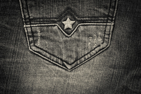 Abstract background of black jeans fabric backgroundの写真素材