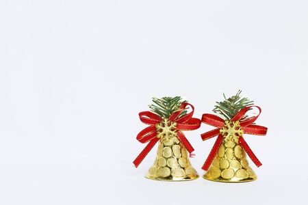 Golden Christmas bell on white backgroundの写真素材