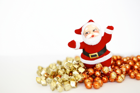 Santa Claus doll with colorful beads on white backgroundの写真素材