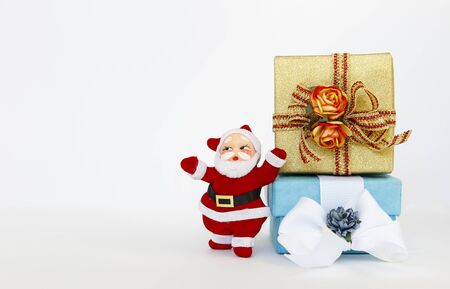 Santa Clause and Christmas gift box on white backgroundの写真素材