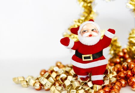 Christmas concept background, Santa clause and colorful beads on white backgroundの写真素材