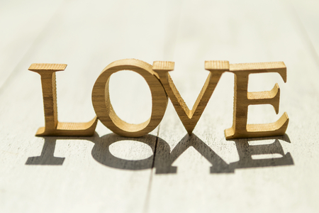 Love on wood backgroundの写真素材
