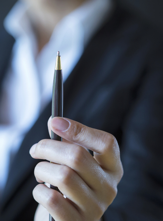 Business concept background, Closeup Business girl holding penの写真素材