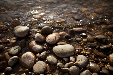 Stone beach on sunset, selective focusの写真素材
