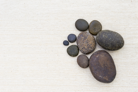 Round stone on canvas backgroundの写真素材
