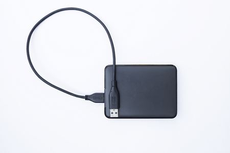 Black external drive on white background