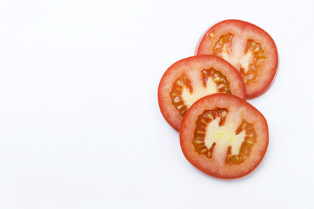 Fresh slice tomato on white backgroundの写真素材
