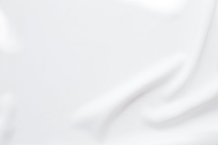 Abstract waving white fabric texture backgroundの写真素材