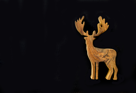 Beautiful wooden reindeer on background, Christmas conceptの写真素材
