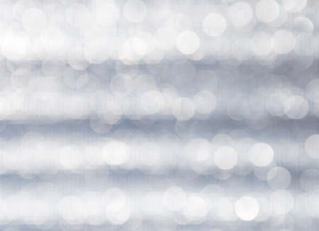 Abstract blurred light bokeh over grey texture background