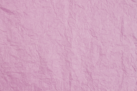 Abstract crumpled pink paper texture background, blank wrinkle pink paper pattern backgroundの写真素材