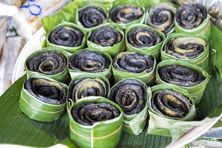 Grill Broken bones tree wrap with banana leaf sale at the fresh market in Thailand, thai style grill...