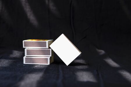 Match box on black background, match box stack with blank cover