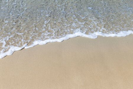 White wave on the clean sand beach, nature concept background, summer time, outdoor day light