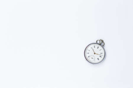 Vintage watch on white background, antique watch with space on white paper texture background, an old timeの写真素材
