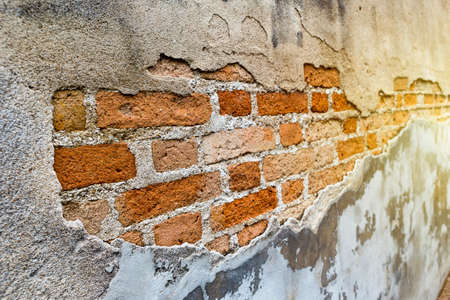 Old brick wall pattern background, vintage warm light, ancient temple wall in Thailand
