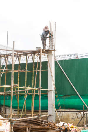 Female worker working on top of construction site, labor day concept, life insurance, dangerious...