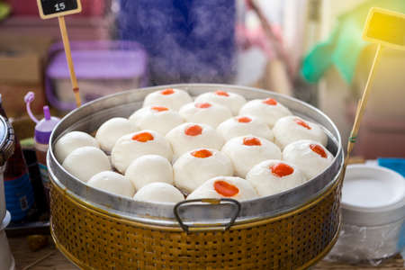 Pork Chinese bun and sweet black beans bun in steamer, Chinese style snack, Asian food marketの写真素材