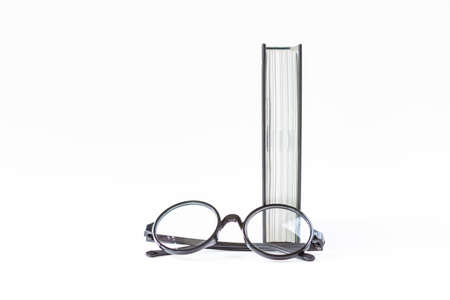 Eye glasses with book isolate on white background, education concept background