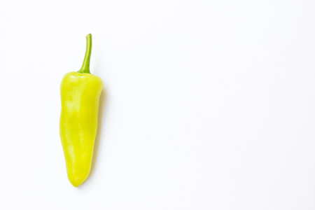 Fresh green chilli on white background, spicy vegetable, organic chilliの写真素材