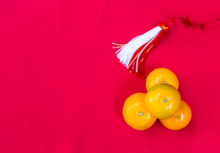 Fresh orange on red fabric background, Chinese new year concept background ideaの写真素材