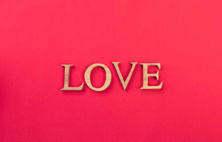 Design love wooden font on red fabric background, valentine card background idea, love and romance conceptの写真素材