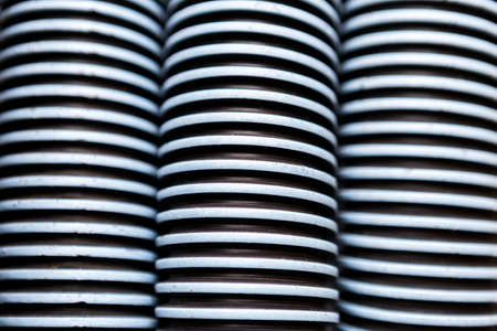 Closeup plastic swimming pool vacuum hose background, manufacturing industry conceptの写真素材