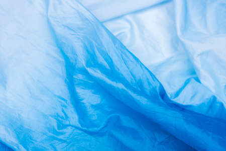Abstract  crumpled Blue and White Gradient color background, blank blue fabric texture backgroundの写真素材