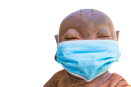 Chinese boy sculpture with face mask isolate on white background, virus protection, protection...