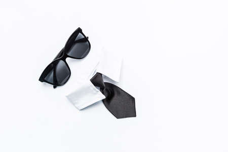 Men fashion, black sunglasses with black necktie and white shirt isolate on white background, formal male fashion conceptの写真素材