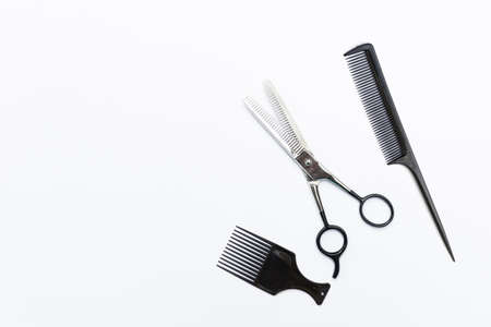 Hair thinning scissor and black comb isolate on white background, hair salon productの写真素材