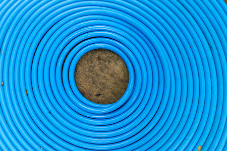Blue plastic water pipe arrange in round shape, garden equipmentの写真素材