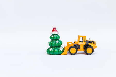 Christmas tree toy with front loader truck on white background, festive season conceptの写真素材