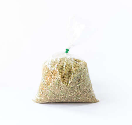 Organic Japanese raw rice in plastic bag on white background, home-grown riceの写真素材