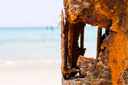 Closeup rusty pole over blurred beach background, ruin old steel pole, outdoor day lightの写真素材