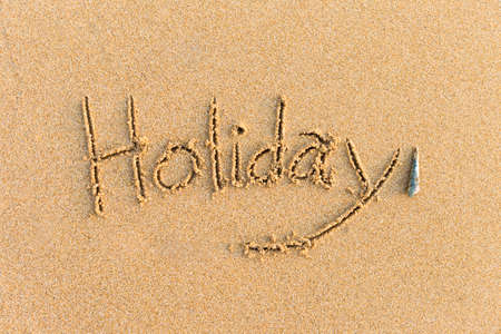 Holiday message on fine sandy beach background, summer holiday, tropical islandの写真素材