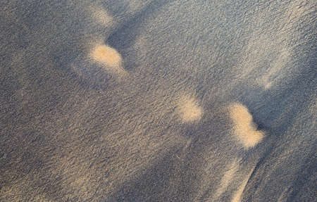 Black sand beach background, natural black sand color from Nang Thong beach in south of Thailand,...